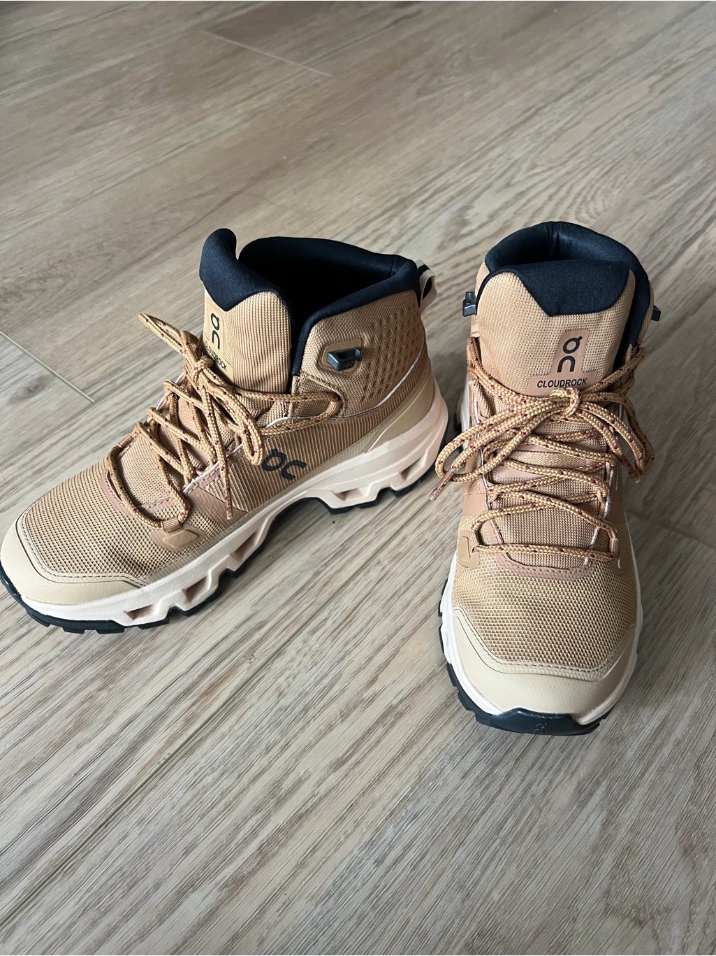 On Running Tan And Black Trail Boots